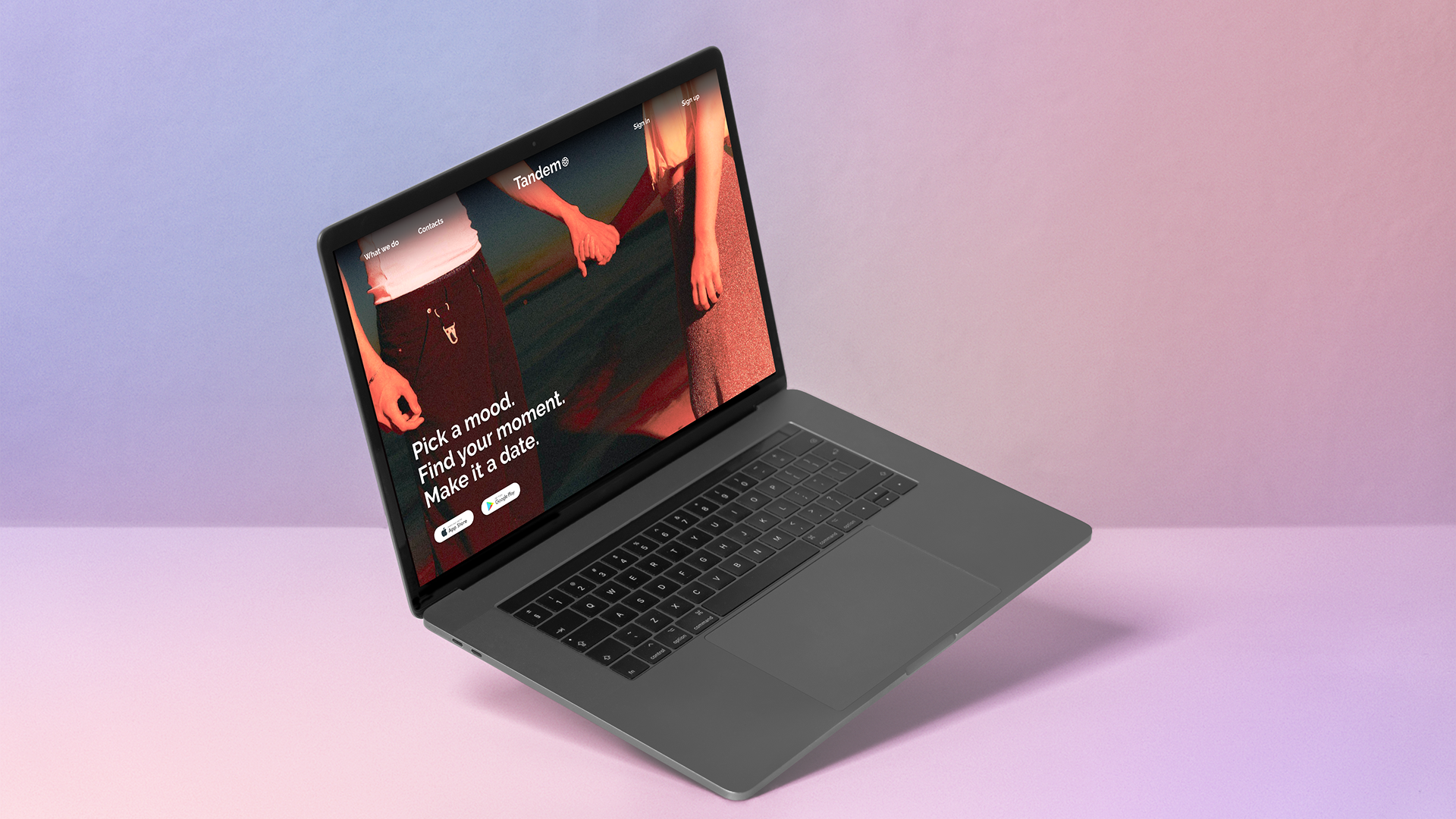 Tandem landing page mocked up on a laptop in a soft pink-purple environment